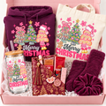 A Christmas-themed gift box set featuring a plum purple hoodie, a cream canvas tote bag, a matching glass tumbler with a wooden lid and straw, a plum purple scrunchie, a burgundy patterned pouch with a tassel, and a Kent coffee bag, all decorated with festive Christmas illustrations and arranged in a pink box.