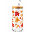 A clear glass tumbler with a bamboo lid and glass straw, decorated with a colorful autumn leaf pattern in red, orange, and yellow on a white background.